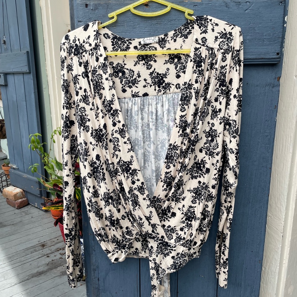 Low cut long sleeved black and white floral free people leotard size medium